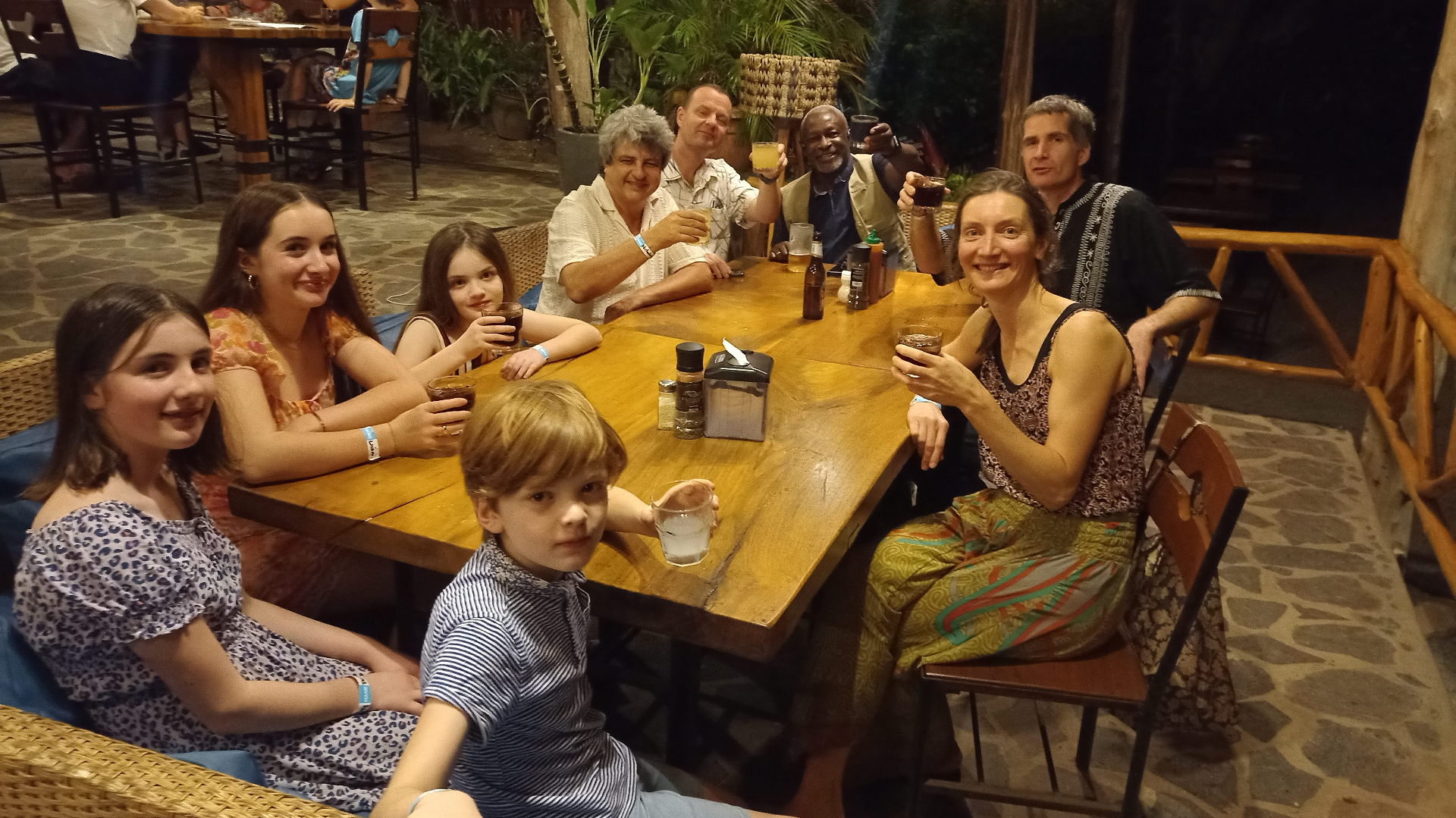 Rachel, Simon and family sharing a meal with friends in Nicaragua